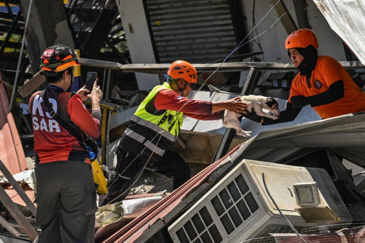 Search and rescue responders in rubble after the General Santos earthquake