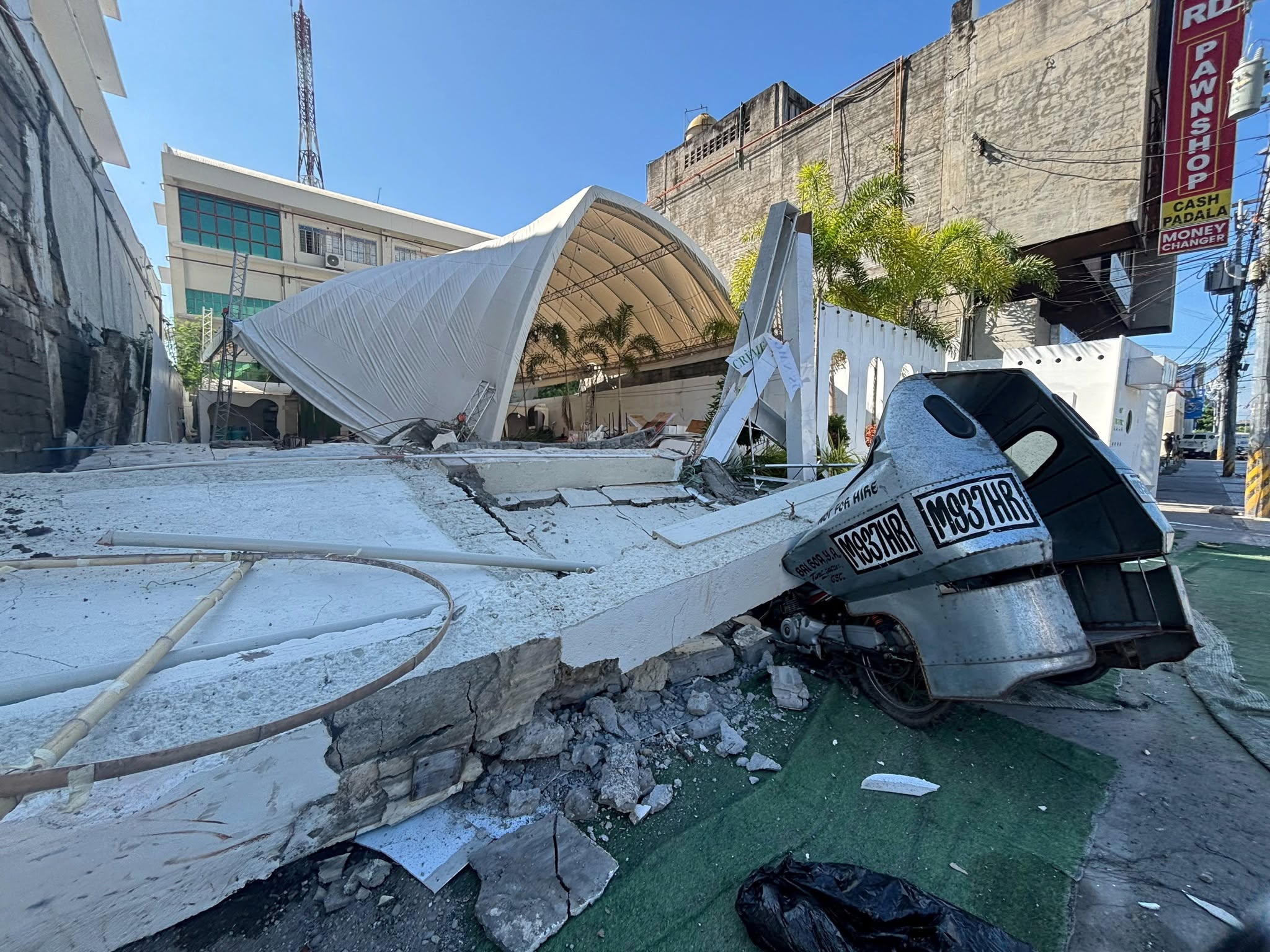 Damaged street and vehicle after the General Santos earthquake