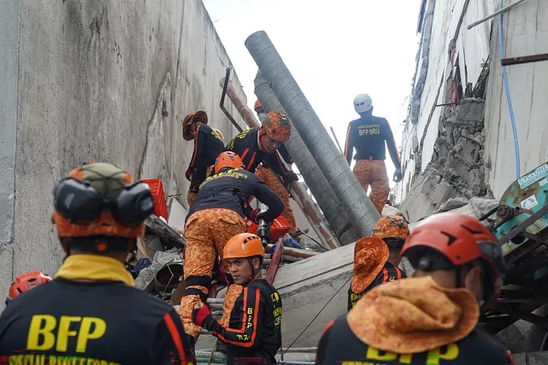 BFP search and rescue teams working through earthquake rubble