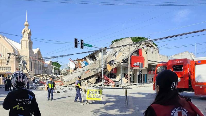 Road closure and emergency response near collapsed building